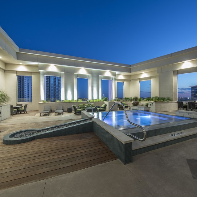 The Arcadian - Rooftop Pool Area with Jacuzzi, Lounge Seating, and Modern Decor