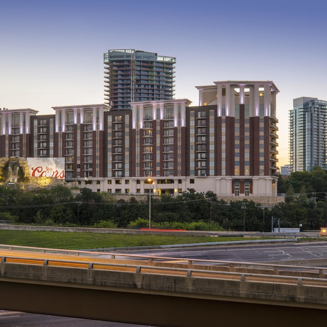 The Arcadian - High-Rise Buildings and a Billboard at Sunset