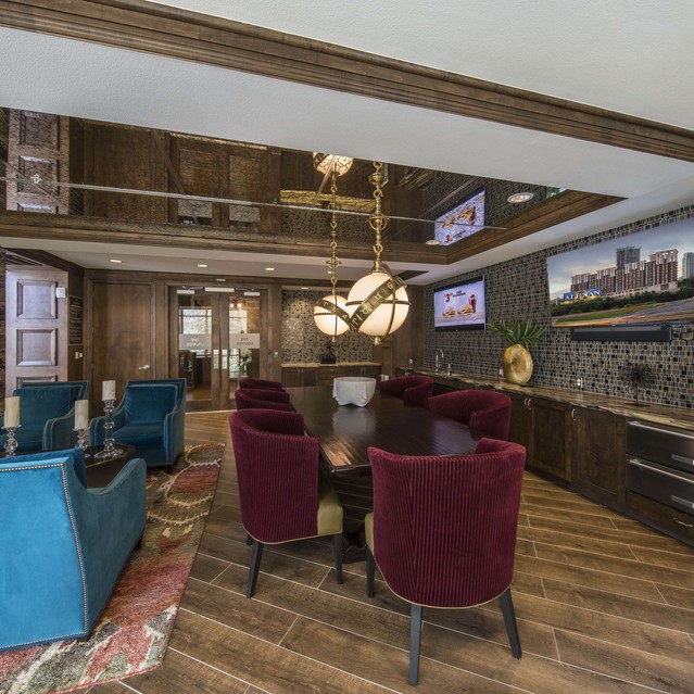 The Arcadian - Dining Area with a Mirrored Ceiling, Elegant Furnitures, and Rich Wood Accents