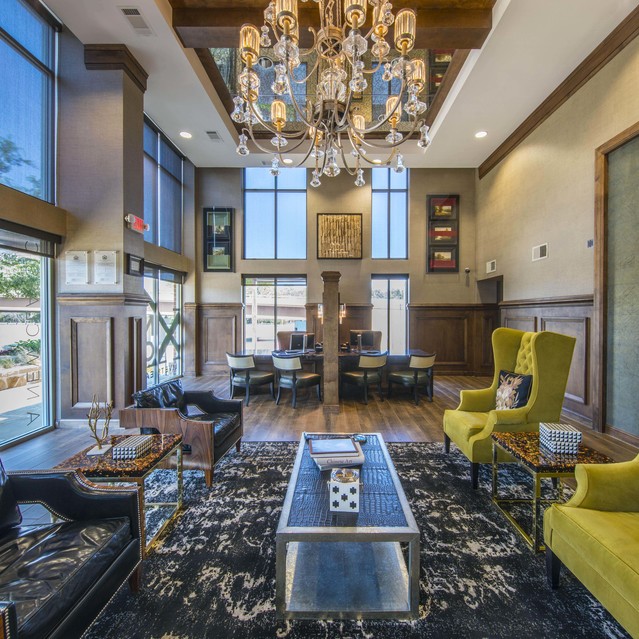 The Arcadian - Luxurious Lounge with High Ceilings and an Ornate Chandelier