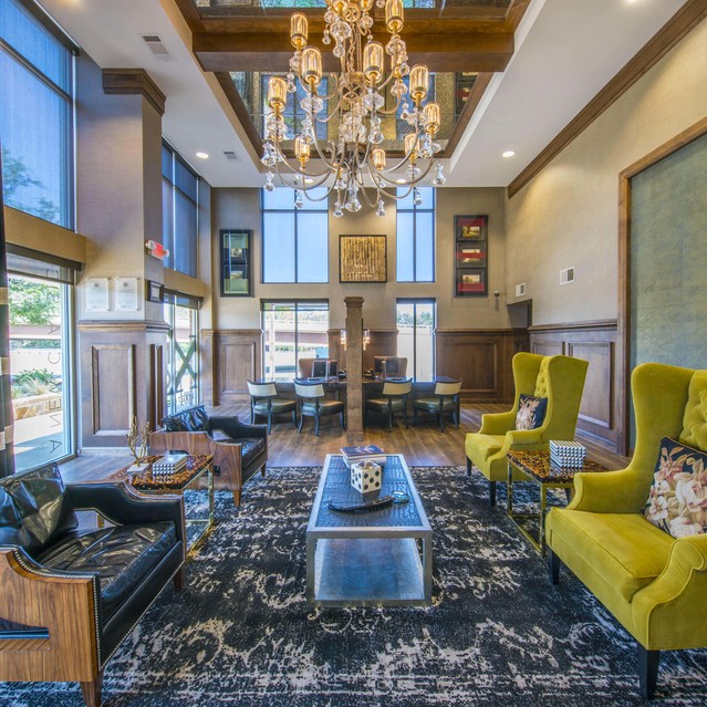 The Arcadian - Luxurious Lobby with Vibrant Yellow Green Armchairs and Wood Style Flooring