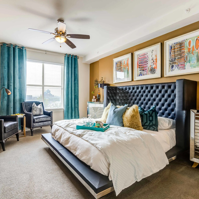 The Arcadian - Elegant Bedroom with a Large Bed, Tufted Headboard, and Teal Accents