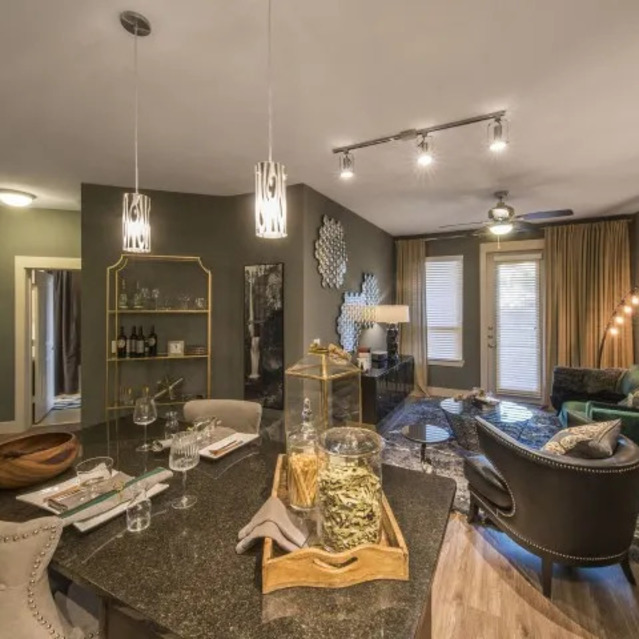 The Arcadian - Stylish Open-Concept Living Area Featuring a Kitchen Island and Modern Furniture